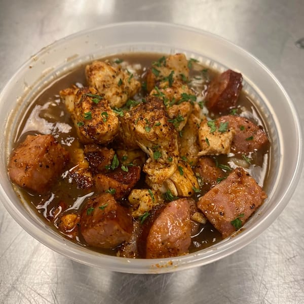A bowl of Take The Wheel Restaurant's American gumbo with chicken, sausage, and parsley.